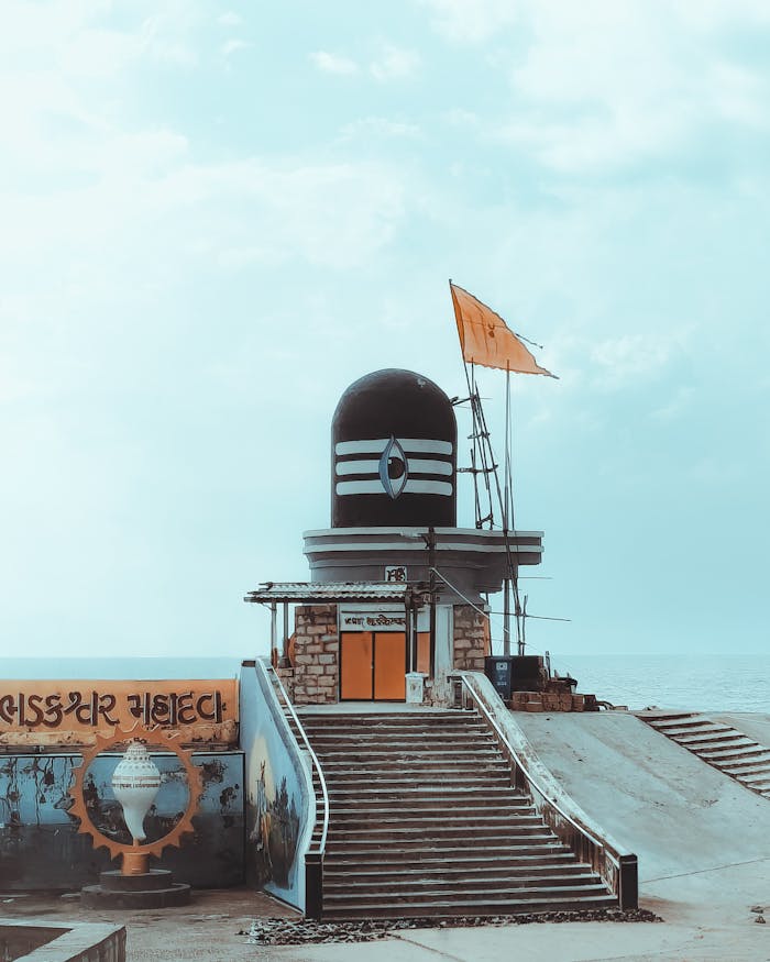 gallery-1 A serene view of the Somnath Shiva Temple in Gujarat, India, by the sea.